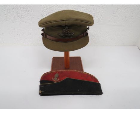 WW2 Royal Artillery Service Dress Cap and Field Service Cap khaki service dress cap with stiff peak.  Brown leather chinstrap