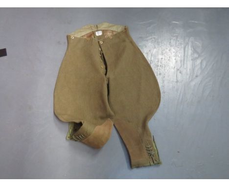 Pair of Officer's Interwar Cord Breeches khaki cord, high V back, wide leg breeches.  Rear waist tightening strap.  Slash hip