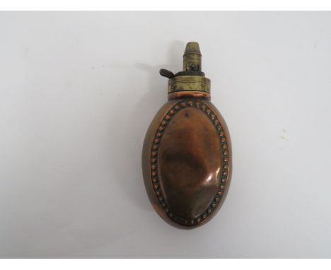 19th Century Beaded Border Copper Flask copper, flat oval body with beaded edge decoration.  Brass top with adjustable nozzle