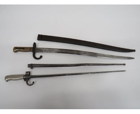 Two 19th Century French Bayonets consisting M1866 French Chassepot bayonet.  22 3/4 inch, single edge Yataghan blade.  The ba