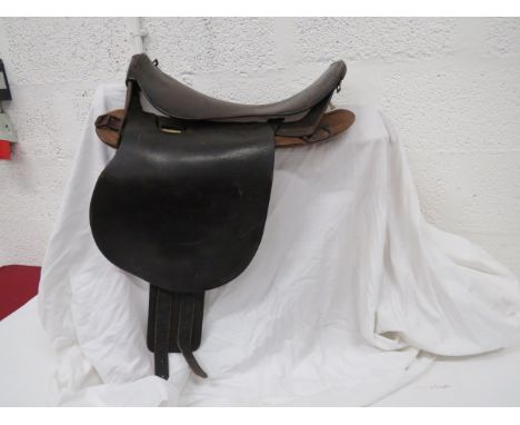 British Army 1898 Driver's Saddle dark brown leather saddle and side flaps.  Front and rear steel arches.  Lower wooden board