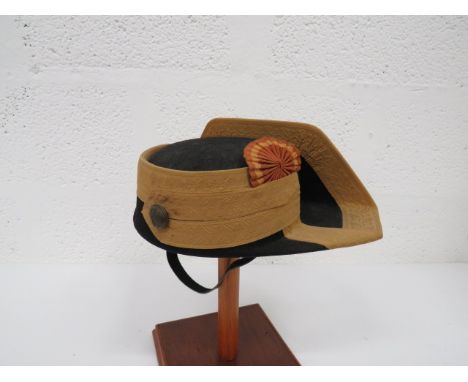Spanish Police Tricornio black felt crown with brim turned up at the rear and curved to the crown at the front.  Brim with wi