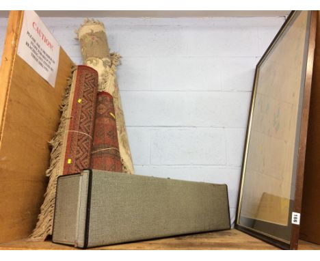 A shelf of assorted, to include rugs