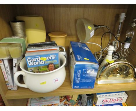 ONE SHELF OF HOMEWARE INCLUDING TABLE LAMPS, CLOTHES IRON, RADIO, CHAMBER POT AND MANTLE CLOCK