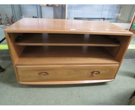 ERCOL LIGHT ELM TELEVISION STAND WITH SINGLE SHELF AND SINGLE DRAWER BENEATH.