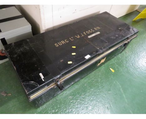 BLACK PAINTED METAL TRAVEL TRUNK WITH PAINTED TITLE AND INITIALS 'SURG LT W J FOGG RN'