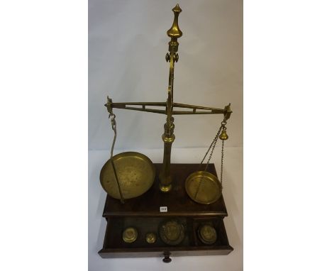 Set of Avery Brass Balance Scales, raised on a mahogany pedestal base, complete with weights