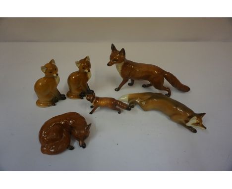 Three Beswick Fox Figures, also with three other ceramic figures of foxes, (6)
