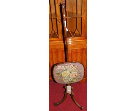 A 19th century mahogany and floral tapestry inset pole screen