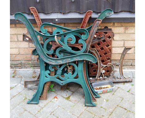 A pair of green painted cast iron bench ends, together with three further similar pairs, and two cast lattice work table tops