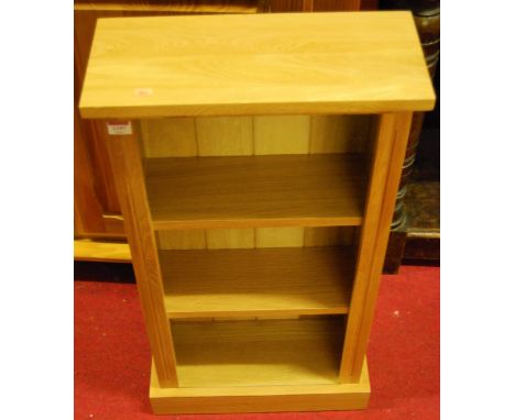 A contemporary light oak narrow freestanding open bookshelf, w.45cm