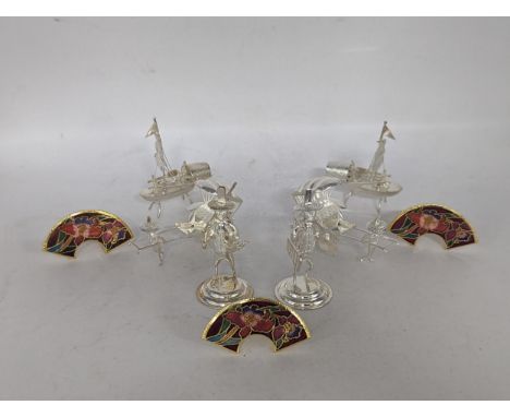 A collection of six stamped 925 sterling silver menu holders in the form of Oriental figures and boats to include a pair of s