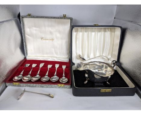 A silver Ladle and sauce boat cased Sheffield 1948 -49 and also 1956 -57 along with a cased set of six teaspoons and an EPNS 