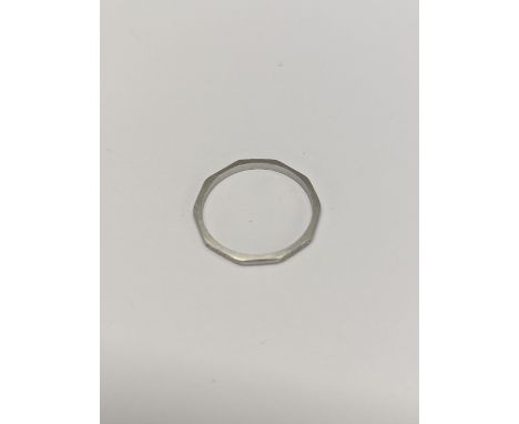 A platinum decagonal ring, engraved decoration to alternate edges, size K ½, 1.7gLocation: 