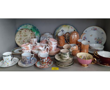 A collection of decorative coffee cans and tea cups with saucers and miscellaneous collectors plates to include RosenthalLoca