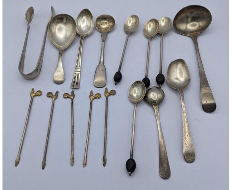 Silver to include a caddy spoon, tea spoons, a sauce ladle, sugar tongs, cocktail sticks and other spoons, 145.5g, four silve