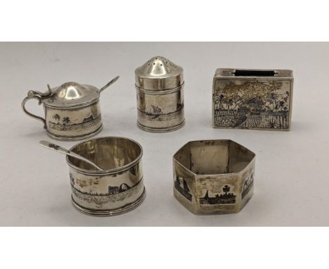 A collection of Middle Eastern white metal and Niello items to include a napkin ring, vesta case, salt pot and other items, 1