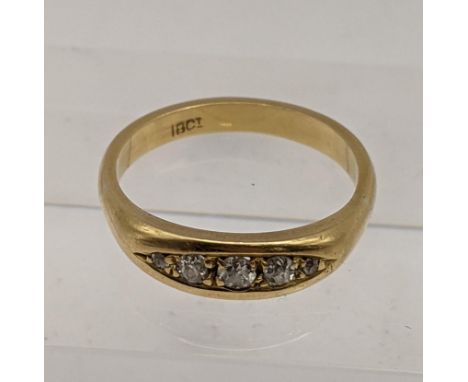 An 18ct gold boat style ring set with diamonds, total weight 4.4g Location: 