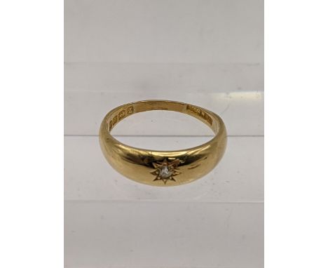 An 18ct gold Starburst solitaire ring set with a diamond, total weight 4.3g Location: 