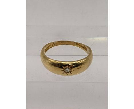 An 18ct gold Starburst solitaire ring set with a diamond, total weight 4.3g Location: 