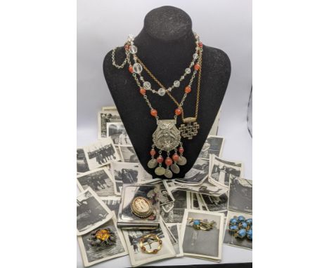 A mixed lot of costume jewellery to include a white metal coral coloured beads, a cameo brooch and othersLocation: 