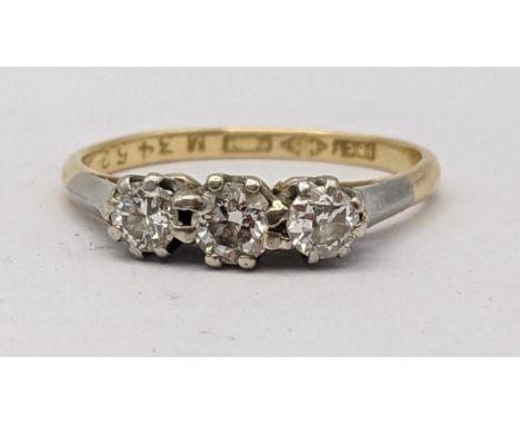 An 18ct gold three stone diamond ring, 2.2gLocation: 