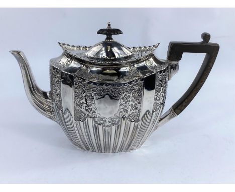 An oval victorian hallmarked silver teapot with extensive embossed gadrooned decoration, Sheffield (possibly) 1897, 18 oz (ma