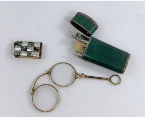 A pair of gilt and blue enamel lorngnettes, a part fitted white metal and shagrine coloured ladies etui and a lighter