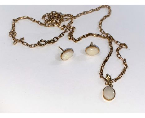 An oval opal style pendant on 9 carat hallmarked gold chain (4gm) and similar earrings 
