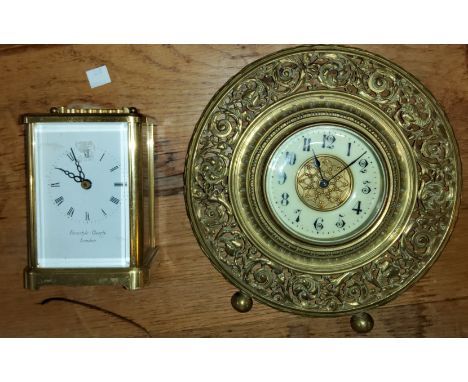 A reproduction carriage clock and a wall clock 