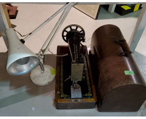 A Singer sewing machine and a vintage angle poise lamp 