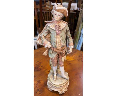 A bisque figure, young man in 18th century dress, in the style of Royal Worcester 