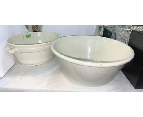 A late 19th century creamware 2 handled butter pail, 35cm and a similar milk basin, 37cm Both pieces are in good condition