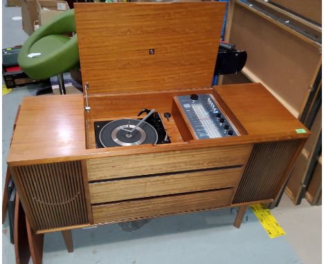 A Garrard record player in a mid century teak record player unit 