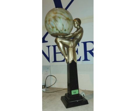 An Art Deco silvered metal figural lamp with polished black marble base and spherical spatter glass shade, 52cm (in good cond