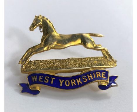 A yellow metal and enamel military badge "West Yorkshire", stamped '9ct', 4.9 gm 