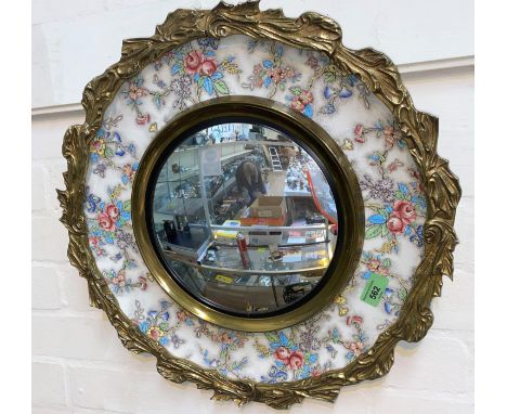 An Artmaster Staffordshire ceramic mirror plaque with brass reef style surround with convex central mirror, diameter 48cm 