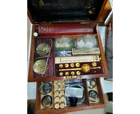 A mahogany medical case containing hydrometer, scales, agate mortar, Pharmacoepia etc, the box with rising lid and fitted low