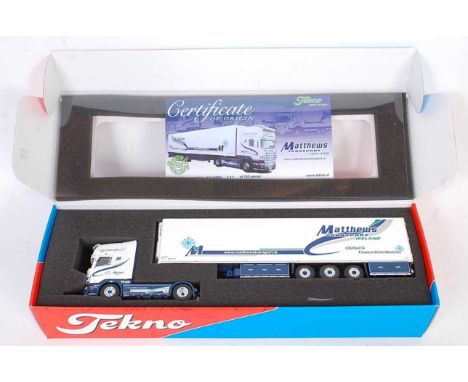 A Tekno 1/50 scale model of a Matthews Transport Scania Topline 580 tractor unit with refrigerator trailer, housed in the ori