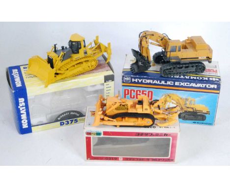 A Komatsu mainly 1/50 scale earth moving construction diecast group to include a First Gear Komatsu D37 bulldozer, a Diapet K