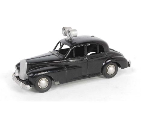 A Morestone Made in England model of a Wolseley 680 Police Car, comprising black body with silver roof siren and silver hubs,
