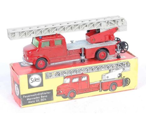 A Siku No. V261 Mercedes Benz DL30H fire engine, comprising of red body with off-white extendable ladder, and attachable hose