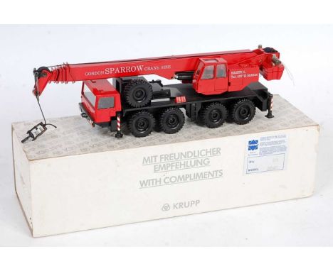 A Conrad No. 2080 1/50 scale model of a Krupp 70GMT telescopic all terrain crane comprising of black and red body, with Gordo