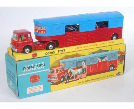 A Corgi Toys No. 1130 Chipperfields Circus horse transporter with horses, comprising of red cab and chassis with matching blu