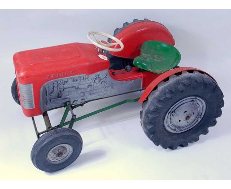 A Triang working tractor pedal car, constructed from plastic and metal components to include silver engine with red engine co