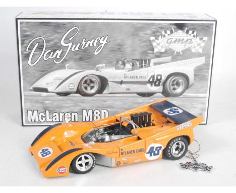 A GMP model No. 12025 1/18 scale model of a Maclaren M8D Dan Gurney race car, housed in the original polystyrene packaging