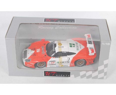 A UT Models No. 39722 1/18 scale model of a 1997 Porsche GT1E 911 race car finished in orange and white with Giesse livery, a