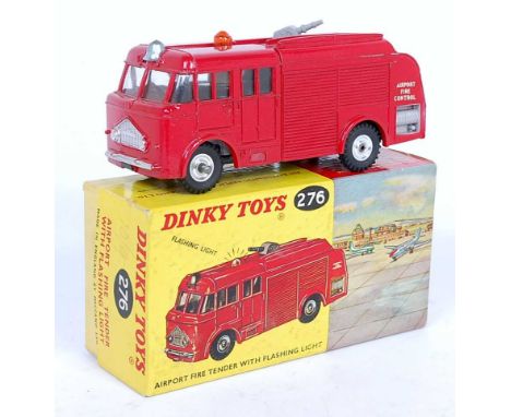 A Dinky Toys No. 276 Airport fire tender with flashing light comprising of red body with spun hubs and housed in the original