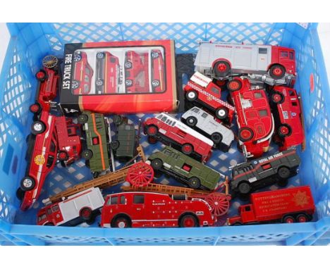 Two trays containing a quantity of various boxed and loose emergency service related diecast vehicles and accessories to incl
