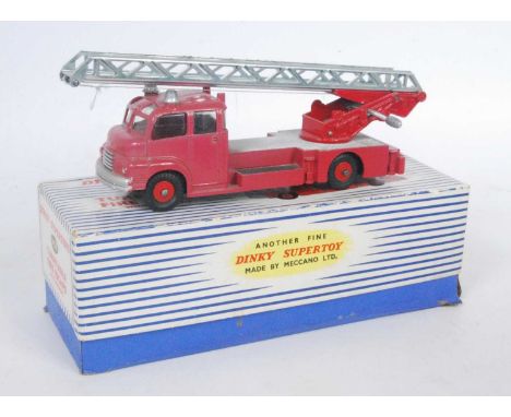 A Dinky Toys No. 956 turntable fire escape comprising of red body with red plastic hubs and silver ladder, model is heavily f